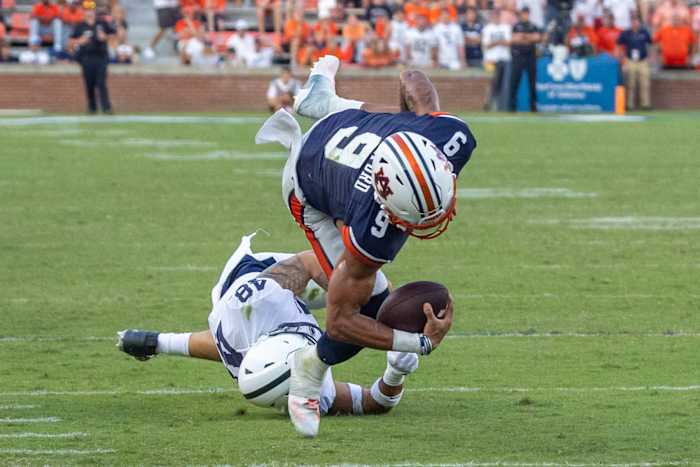 Robby Ashford is tackled against Penn State.